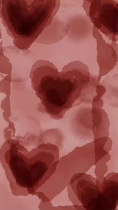 red hearts are arranged in the shape of heart shapes on a pink and white background