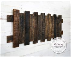 a wall hanging made out of wooden planks