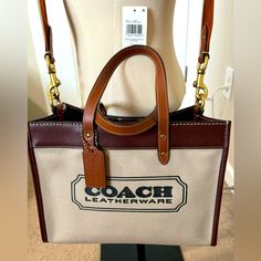 * Like New With Tag* Style #: C8459 Materials And Details: Canvas And Refined Calf Leather Inside Zip Pocket Snap Closure, Fabric Lining Handles With 5 1/2" Drop Detachable Strap With 24 1/2" Drop For Shoulder Or Crossbody Wear Four Protective Feet At Base 11 3/4" (L) X 9" (H) X 6" (W) Style No. C8459 Rfs: De-Cluttering Coach Field Tote 30, Coach Field Tote, Tan Brown, Womens Tote Bags, Coach Bags, Snap Closure, Calf Leather, Zip Pockets, Handles