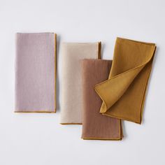 three different colored napkins sitting next to each other