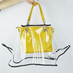 Description: [Quality Material]: This Clear Rain Cover for Handbags is made from quality, , and waterproof material. It effectively protects your handbag from rain, snow, dust, and spills, ensuring your belongings stay dry and clean. [Universal Fit]: Our Bag Rain Cover is designed to fit most handbag sizes and s. to put on and take off, making it a convenient accessory for all your outdoor activities. [Clear Design]: Clear design allows you to easily identify your bag's contents without needing Glass Plastic Bag, Handbag Protector, Clear Raincoat, Plastic Handbag, Clear Handbags, Foldable Bag, Practical Bag, Rain Gear, Luxury Bag