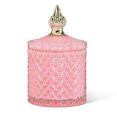 a pink glass jar with a gold lid