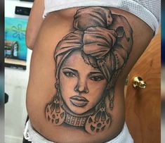 a woman's stomach with an image of a woman on the side and her head in