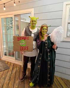 two people dressed up as shrap and the bride are holding signs that say beware of the duke