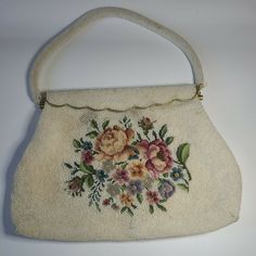 Vintage 1930's Cross Stitch Beaded Handbag Magnetic Closure and Inner Pockets. Item is in Pre-owned condition.  Purchased at an estate sale. Owner of the sale dated this bag to pre-war era. See attached photos for tiny imperfections on bag from many years of love. Vintage Beaded Beige Bags, Embroidered Rectangular Bag For Vintage Events, Embroidered Rectangular Bags For Vintage Events, Rectangular Embroidered Bags For Vintage Events, Vintage Cream Handheld Bag, Vintage Beaded Shoulder Bag For Everyday Use, Vintage Embroidered Cream Bag, Vintage Cream Embroidered Bag, Vintage Beaded Shoulder Bag