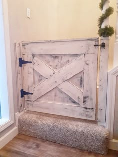 an old barn door is being used as a bench for the entryway to a house