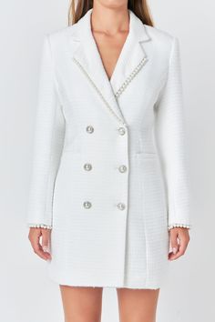 Upgrade your wardrobe with our elegant Pearl Trim Blazer Dress. This sophisticated blazer-style dress is crafted from high-quality tweed fabric, giving it a luxe look and feel. The mini length makes it perfect for any occasion, while the collar and lapel add a touch of chicness. The subtle pearl trim detailing adds a touch of glamour to this classic dress. From formal events to day-time outings, this versatile dress is a must-have. Shop now and elevate your style game with our Pearl Trim Blazer Dress. Tweed Blazer dress Mini length Collar and lapel long sleeves Double breast Pearl button Pearl trim detail at lapel and sleeve Lining Hand wash cold Do not bleach Do not tumble dry Iron low Shell: 100% Polyester Lining: 100% Polyester HN2015D Total length: 33.5" Bust: 34.5" S WHITE: Height 5'9 Tweed Blazer Dress, Knitwear Trends, Knit Loungewear, Strapless Bodycon Dress, Blazer Style, Denim Sweater, Tweed Dress, Tweed Fabric, Leather Dresses