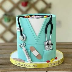 a cake that is shaped to look like a doctor's hat and stethoscopes