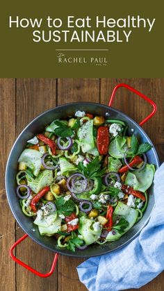 a pan filled with vegetables on top of a wooden table