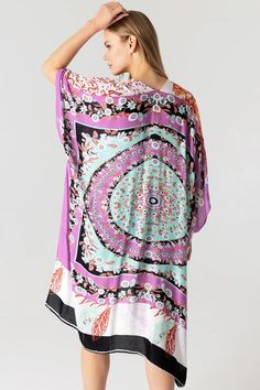 Boho print kimono with contrasting prints. Ultra light, draping open-front. Light and billowy silhouette, perfect for effortless layering. CARE | Hand Wash Cold or Dry Clean CONTENTS | 100% Viscose MEASUREMENTS | 36"/91 cm Top to Bottom (Size O/S) MODEL | 5'8 - wearing O/S IMPORTED Multicolor Printed Wrap Cover-up, V-neck Printed Kimono For Festivals, Flowy Open Front Printed Cover-up, Multicolor Printed Kimono For Beach Cover-up, Multicolor Printed Cover-up With Kimono Sleeves, Multicolor V-neck Kimono With Floral Print, Multicolor Floral Print V-neck Kimono, Spring Kimono With Abstract Print, Printed Kaftan For Daywear