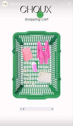 a green shopping cart filled with clothes and other items on it's side, in front of a white background