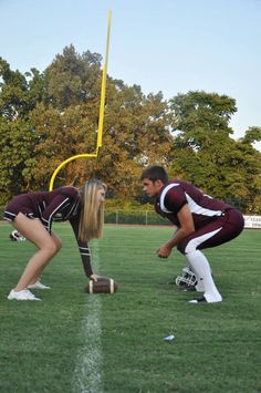 two football players kneeling down on the field