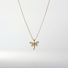 A dragonfly pendant made of gold, around your neck its beauty to unfold, fluttering style and grace it will hold, a treasure to cherish, forever bold. This 14K real solid gold Dragonfly Pendant depicts a dragonfly with delicate, intricately crafted wings made of warm yellow gold contrasted by a body made of shining white. The combination of yellow and white gives this nature-inspired jewelry a unique and eye-catching look. A gold animal charm pendant can be very symbolic and this 14k gold dragon Gold Dragonfly Necklace For Gift, Elegant Gold Dragonfly Necklace, Yellow Gold Dragonfly Jewelry Gift, Yellow Gold Dragonfly Jewelry For Gifts, Elegant Gold Dragonfly Jewelry, Gold Animals, Dragonfly Charm, Dragonfly Necklace, Gold Dragon