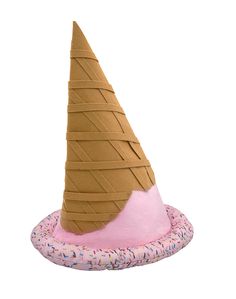 an ice cream cone with sprinkles is on top of a donut cushion