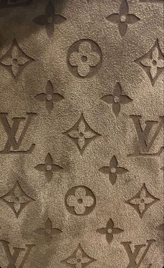 the louis vuitton logo is etched into concrete