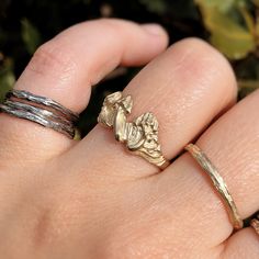 FREE SHIPPING - on orders over 150€ - code FREESHIPPINGBANDIDO at checkout. Dainty little mushrooms growing on your fingers. Hand carved in wax and casted in 9K gold.  All items are Hallmarked. * MADE TO ORDER * | Details | * 9K Gold * Weight = 3,05 g * Fine gold = 1,14 g * Gold percentage = 37,5 % | Sizing | Need help with sizes? Enter here: https://bandidojewelry.com/pages/size-guides | Shipping | All orders are shipped by: Internationally = DHL Domestically = Corrida do Tempo | Legal Compliance | All about legal compliance: https://bandidojewelry.com/pages/legal-compliance Unique Hand Cast 14k Gold Rings, Adjustable Gold Whimsical Rings, Hand-cast 14k Gold Rings Perfect For Gifts, Whimsical Adjustable Gold Rings, 14k Gold Hand Cast Rings As Gift, Unique Hand Cast Stackable Rings As Gift, Whimsical Gold Ring Jewelry, 14k Gold Hand Cast Rings For Gift, Nature-inspired Brass Rings For Gifts