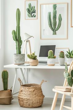 a white desk topped with lots of potted plants