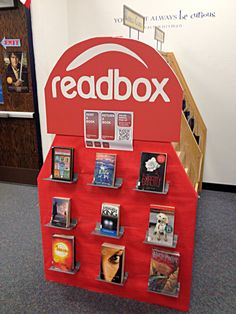 a display case with various items on it in an office cubicle, and the word xodbosi is displayed