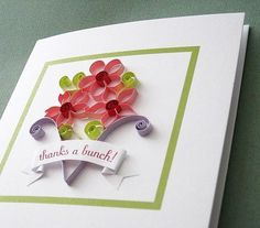 a greeting card with flowers on it that says thanks a bunch, and the words thanks a bunch are cut out of paper