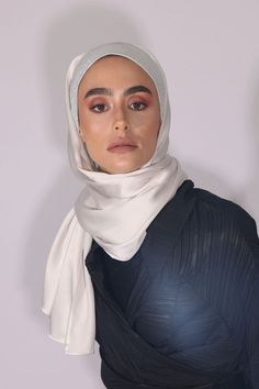 Al Johara is one of our most delicate and sophisticated hijab designs. Pure Satin Silk with shiny and stretchy front fabric. Doesn’t slip, easy to be tied and fixed from behind your head to allow free flow and stability without the need for a front pin or underscarve. However, if you choose to pin it, you can use our collection of the No-Snag Hijab Magnets to save the delicate fabric. 72”x27” Satin Silk, high-shine fabric, very drippy, lightweight, and smooth hijab made especially for those of y Elegant Solid Niqab For Eid, Elegant Niqab For Eid, Elegant Wedding Hijab, Elegant Silk Scarf For Eid, Hijab Magnets, Silk Hijab, Hijab Designs, Free Flowing, Satin Silk