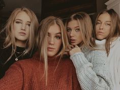 three beautiful young women posing for the camera