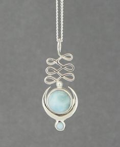 The unalome symbol is a winding line that represents the path to spiritual enlightenment. The Moon represents our journey, and larimar gemstone signifies calm for the journey. All come together in this artistic sterling silver pendant. Artistic and symbolic gemstone pendant Made of sterling silver and larimar gemstone Measures about 1.25" long Sold as a pendant, to add a chain, see above Handmade, each pendant is slightly different Hand-finished, please allow for slight variations in color, deta Unalome Symbol, Malachite Pendant, Larimar Pendant, Malachite Stone, Spiritual Enlightenment, Funky Jewelry, Silver Moon, Moonstone Pendant, Our Journey