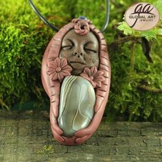 This Clay Goddess Necklace is made from Polymer Clay and a piece of nice quality Botswana Agate and Garnet bead, It comes with a nice gift box( the color of the gift box is in casual ). The Pictures was took by the natural Daylight.   Item Description: S/N :                     GA03512 WEIGHT :            32g (1g= 5 Ct) SIZE:                    70x35x17mm( 1 inch =25.4mm) QTY:                 1 PCS Drilling :            Whole hole Terms of Policy 1.Please email us if you have any questions We wi Nature-inspired Agate Jewelry For Gifts, Artisan Carved Necklaces As A Gift, Handmade Spiritual Necklaces For Gifts, Carved Agate Jewelry For Gift, Artistic Agate Necklace As Gift, Artistic Agate Necklace Gift, Artistic Agate Necklace For Gift, Hand Wrapped Agate Necklace For Gift, Carved Round Beads Jewelry Gift