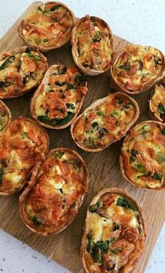 small quiches are arranged on a cutting board