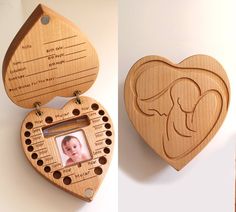 a wooden heart shaped box with a baby's photo in the center and an elephant carved into it