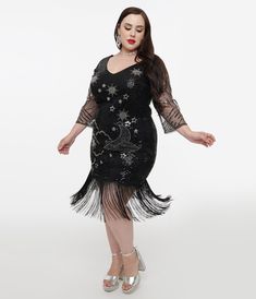 Picture yourself an devotee of Margaux, ladies? Head to your beloved chateau in this twinkling frock from Unique Vintage and make a scene. The brilliant black mesh is sparkling with silver beads and sequins in a stars & moons design throughout your silhouette while a matching knit lining clutches curves and keeps you comfortable while showing off your feminine figure. The sexy V-neckline is framed by elegant three-quarter length sleeves while the jaw-dropping scalloped high hem boasts dramatic long fringe. Outfitted with a side zipper to nip in your hourglass, give a toast to Margaux!.Available in sizes S-3X while supplies last. | Unique Vintage Plus Size 1920S Black & Silver Moon & Stars Sequin Margaux Flapper Dress | Size 1X/16 Plus Size 1920s, Vintage Plus Size, Long Fringe, Long Fringes, Silver Moon, Moon Stars, Moon Design, Black Mesh, Nordstrom Dresses