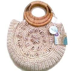 Perfect Summer Bag By Sigrid Olsen, Handmade In India. This Crocheted Purse Is Decorated With Shells On The Front And Features A Round Wooden Handle. Fabric Interior With Zip Pocket. Magnetic Snap Closure. Approximate Measurements: From Top Of Handle To Bottom Of Bag, 13.5”. The Bag Itself, Without Handle, Is About 9x11. No Flaws, New With Tags. Beige Handwoven Shoulder Bag With Round Handle, Beige Handwoven Round Handle Shoulder Bag, Beige Bohemian Hobo Bag, Bohemian Beige Hobo Bag, Beige Crochet Bag With Round Handle And Handwoven Details, Beige Crochet Bag With Round Handle, Beige Handwoven Bag With Round Handle, Cream Bags With Braided Round Handles, Beige Bohemian Straw Bag With Handles