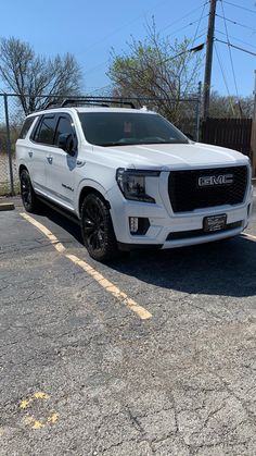 a white truck parked in a parking lot