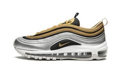 The Nike Air Max 97 is one of the most revered Nike running shoes of all time. This special edition silhouette sees color blocking at its finest. The upper sports a back mesh with silver and gold metallic overlays and a shiny silver mudguard. Red branding hits the side panel and tongue, and a foil-infused heel loop completes the pair. As it’s done for over two decades, the Nike Air Max 97 hosts a foam sole with full-length Max Air cushioning. | W Air Max 97 SE Metallic Gold Air Nike 97, Custom Air Max 97, Nike Air Max 97 Reflective, Red Branding, Nike Air Max 97 Leopard, Nike Air Max 97 Gold, Nike Running Shoes, Glitter Sneakers, Air Max Women