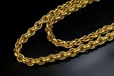 This elaborate Victorian era yellow gold chain necklace was made in the 19th century, circa 1850s-1870s.  The gold of the necklace was tested to be in the 17 to 18 karat range.  Length is 124 cm (48 in.)  Width is 5 mm (3/16 in.)  Weight is 75 grams.  The clasp is a modern replacement. Classic Formal Double Chain Necklace, Formal Rope Chain Necklace, Antique Formal Chain Necklaces, Formal Yellow Gold Long Chain Necklace, Formal Yellow Gold Necklace With Double Chain, Yellow Gold Double Chain Necklace For Formal Occasions, Victorian Gold Chain Link Necklace, Victorian Yellow Gold Chain Link Jewelry, Victorian Gold Chain Necklace