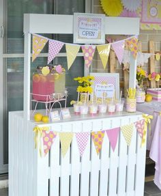 a pink and yellow birthday party with decorations