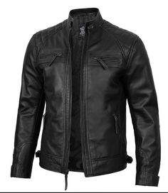 A men's black cafe racer biker leather jacket typically features a sleek, minimalist design that is iconic in motorcycle culture. It often includes: Material: Genuine leather (sometimes faux leather) for durability and style. Color: Black is the most common color, offering a classic and versatile look. Style: Cafe racer style characterized by a fitted cut, snap collar, and sometimes quilted shoulders or elbows for added protection and style. Details: Zippered cuffs, multiple pockets (often with Black Cafe Racer, Racer Leather Jacket, Cafe Racer Leather Jacket, Black Leather Jacket Men, Semi Formal Outfits, Cafe Racer Style, Biker Leather Jacket, Motorcycle Culture, Aviator Jackets