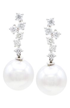 Easy-to-wear drop earrings will add significant polish to even your most casual ensembles. Pearl size: 13–14mm Total diamond weight: 1.05ct. Color: F–G Clarity: SI 14k gold/freshwater pearl/diamond Imported Diamond Guide Dazzling White Drop Cluster Earrings, Dazzling White Cluster Drop Earrings, White Cluster Earrings With Brilliant Cut For Formal Occasions, Formal White Cluster Earrings With Brilliant Cut, Formal White Brilliant Cut Cluster Earrings, White Cluster Earrings With Prong Setting For Formal Occasions, Formal Diamond White Pearl Dangle Earrings, White Sterling Silver Cluster Earrings For Formal Occasions, Formal Pearl Drop Diamond Earrings