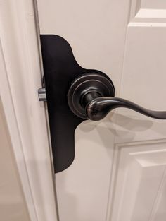 an open door with a black handle on it