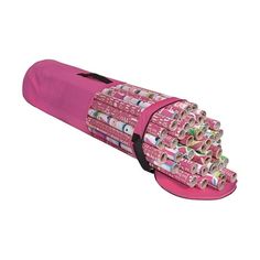 a pink tube filled with lots of rolled up papers