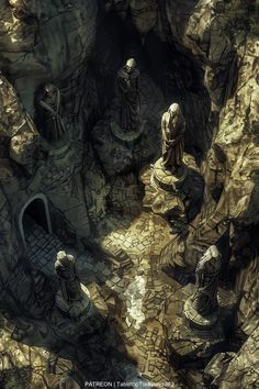 an aerial view of some statues in a cave