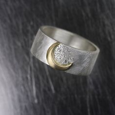 Sternenfall (star fall) is my newest romantic moon and stars wedding band design. A wide bridal ring contains a golden crescent moon and 10 sparkly diamond stars. This unique piece is perfect for the celestial bride. Made from sterling silver, 14k yellow gold and high quality diamonds. Ring Width: 8mm Ring Thickness: 1.2mm << Diamond Specs >> Shape: round brilliant Diameter: 1mm Amount: 10 Quality: VS Color: G+ *Made to order in your size (Please allow 2 weeks) nangijalajewelry.etsy. Celestial Bride, Star Wedding Band, Stars Wedding, Wedding Band Designs, Yellow Gold Diamond Ring, Band Design, Meteor Shower, Diamonds Ring, Gold Diamond Ring