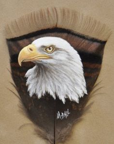 an eagle's head is painted on the side of a piece of cardboard paper