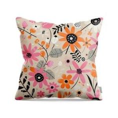 a white pillow with pink and orange flowers on the front, sitting on a white background