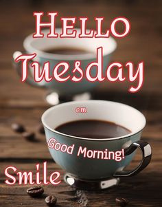 two cups of coffee sitting on top of a wooden table with the words hello tuesday