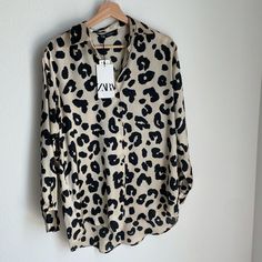 Beautiful Animal Print Buttondown Shirt. 100% Polyester Runs Large. Please Let Me Know If You Need Measurements You Will Love This Shirt! Chic Printed Button-up Shirt, Leopard Print Long Sleeve Top With Buttons, Long Sleeve Leopard Print Top With Buttons, Casual Collared Leopard Print Tops, Casual Printed Button-up Blouse, Trendy Beige Shirt With Buttons, Trendy Beige Shirt With Button Closure, Cream Long Sleeve Shirt For Day Out, Cream Shirt For A Day Out In Fall