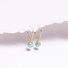 Amazonite Earrings - 14k Gold Filled Ear Wire Hoops with sphere / ball shaped genuine Amazonite gemstones - Unique Mother's Day Gifts Gemstones: 9x6mm approximately Bezel: Vermeil Gold (14k Gold over Sterling Silver) Ear Wires: 14K Gold Filled Wire: 21 gauge / 0.70mm thick Wire Diameter: 15mm Gemstone: Genuine Amazonite Note that due to the handmade nature of these genuine stones, measurements are approximately and might vary slightly for each stone. Amazonite Earrings, Unique Mothers Day Gifts, Store Jewelry, Earrings Dainty, Gorgeous Necklaces, Jewelry Earrings Hoops, Ear Wire, Jewelry Care, Ear Wires