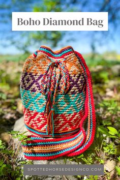 a colorful bag sitting on top of a tree stump