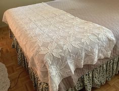 a bed with a white bedspread on top of it