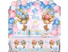 a baby shower table with balloons and teddy bears on it, along with a banner that says boy or girl