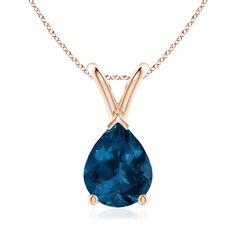 Suspended from a lustrous V bale is a vibrant pear-shaped London blue topaz. It is held in a three prong setting with a V prong securing the tapering tip. Crafted in 14k rose gold, this classic solitaire London blue topaz pendant allures with its pleasing hue. November Birthstone Jewelry, Bracelet Love, Blue Topaz Pendant, Topaz Pendant, Solitaire Pendant Necklace, Blue Topaz Stone, Pretty Necklaces, Modern Necklaces, Topaz Stone